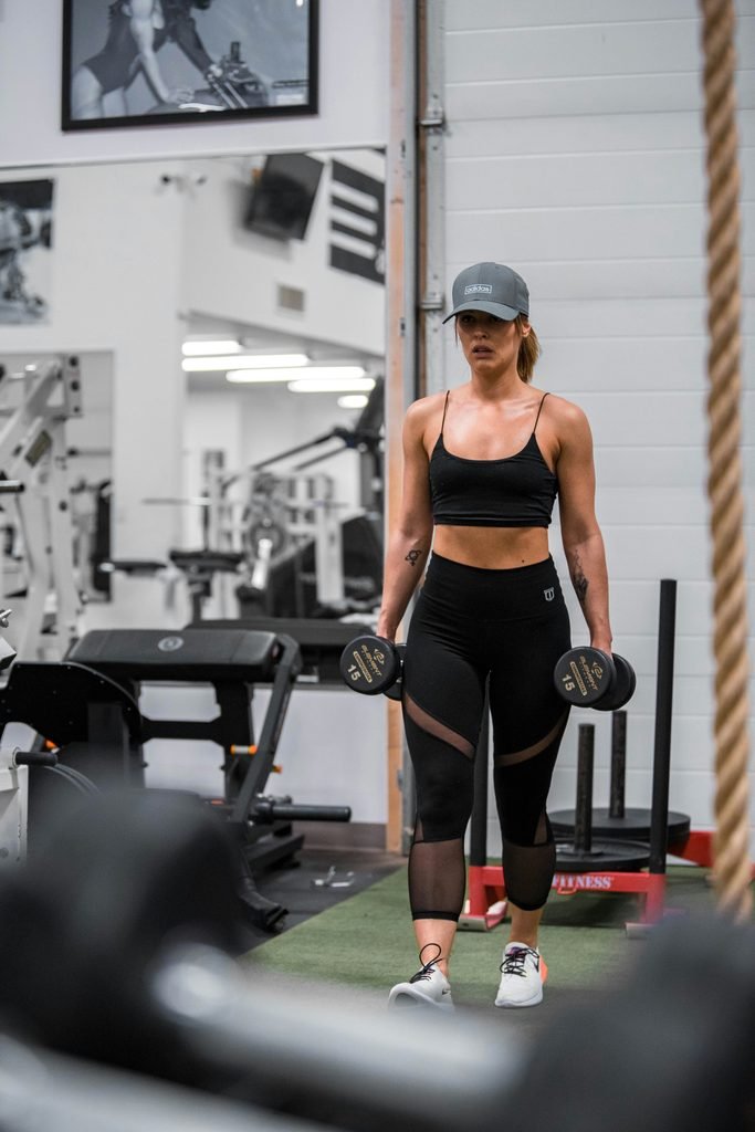 Athlete exercising in a gym.